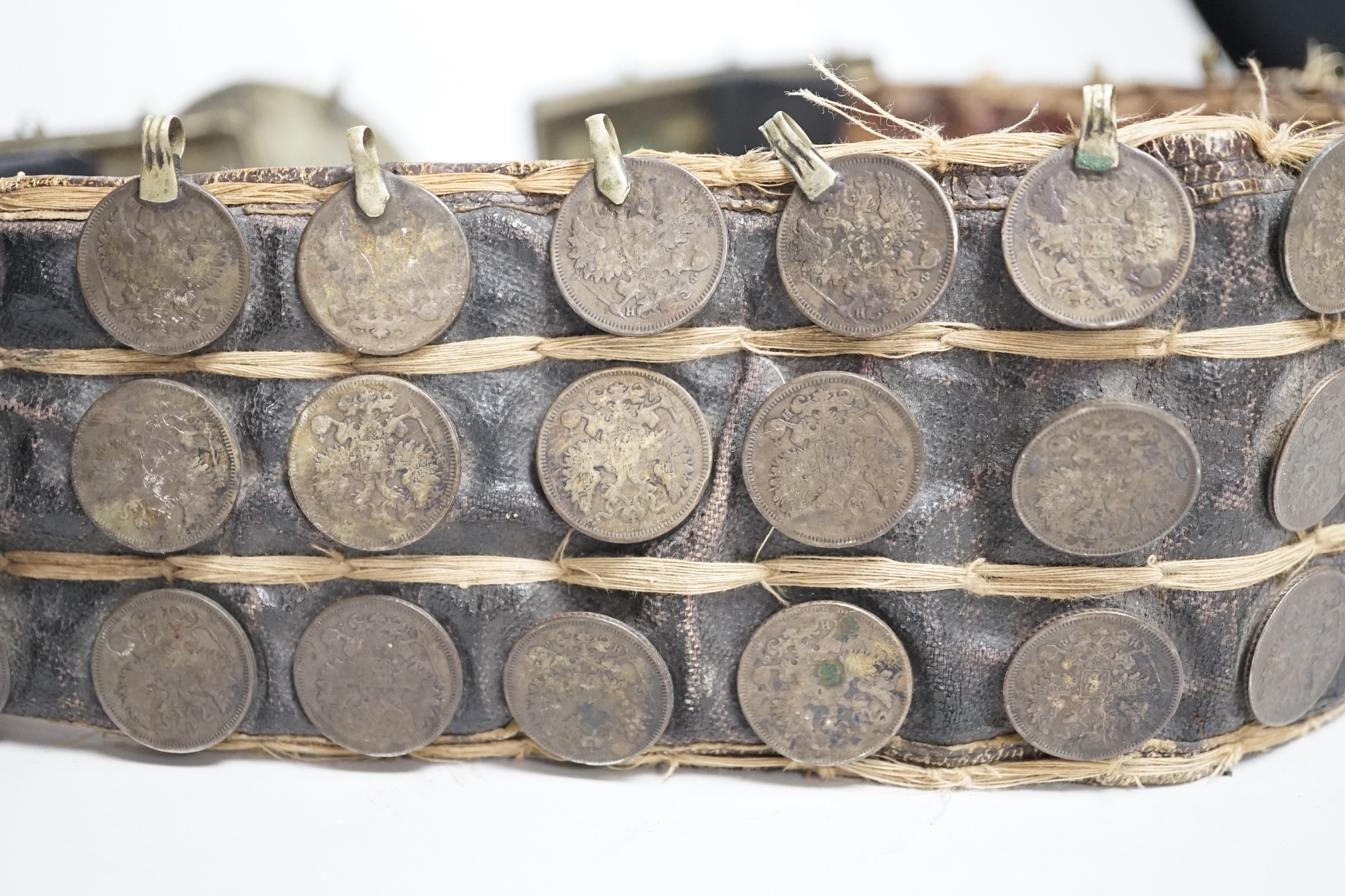 A 19th century Afghan belt, Russian coin mounted